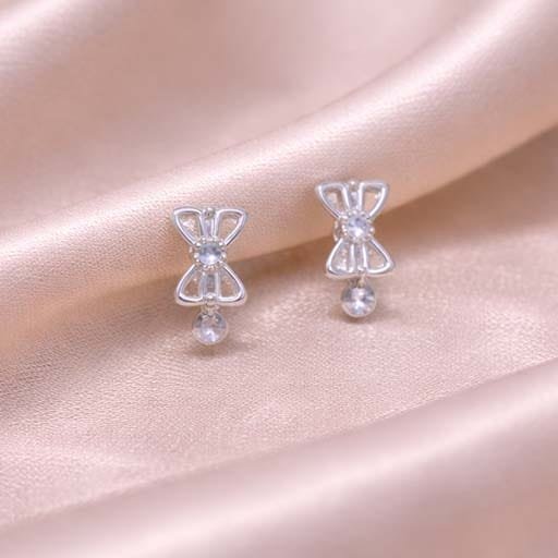 Crystal Bow Silver Huggie Earrings - Image 2